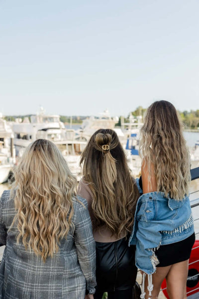Girls on the balcony wearing Maui Hair Extensions